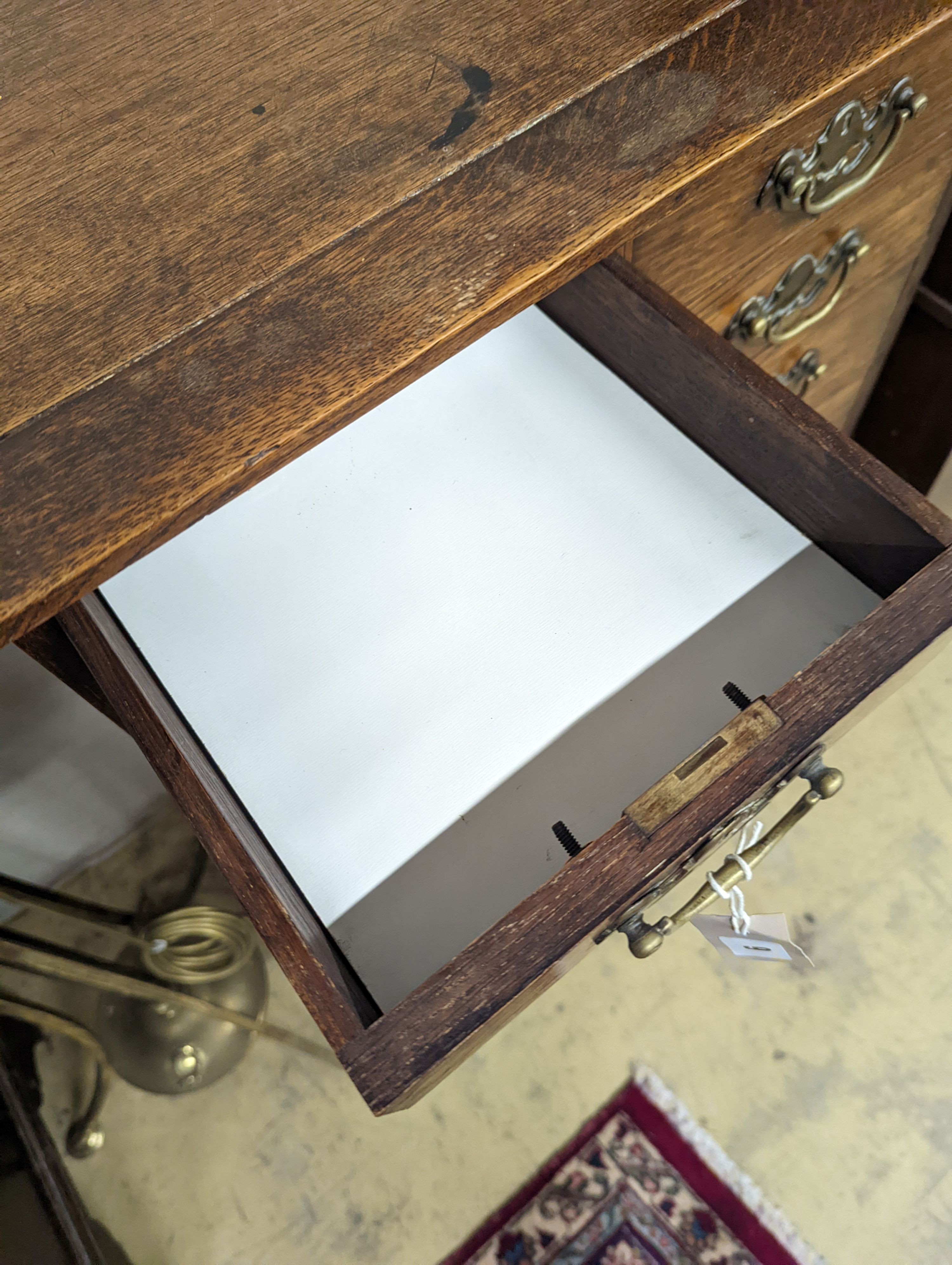 A small early 20th century oak tall chest, fitted ten drawers, width 60cm, depth 37cm, height 111cm